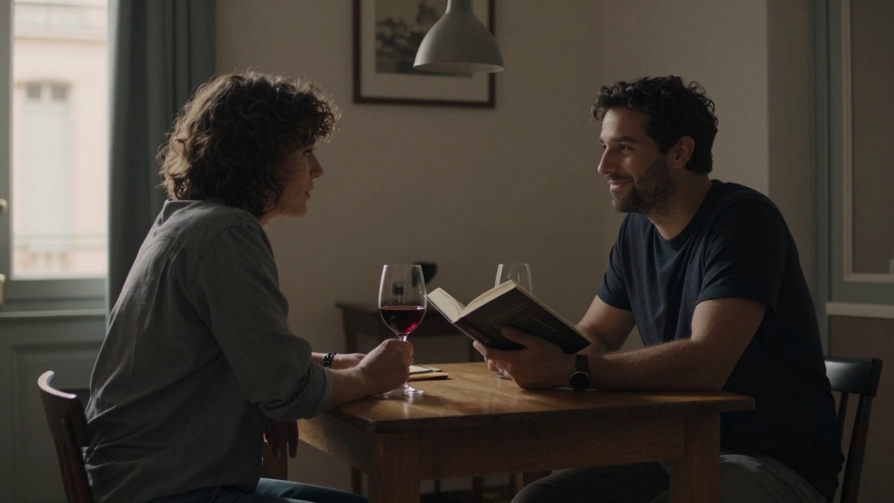 Two people share quiet conversation over wine in a softly lit Toulouse apartment, no physical contact.